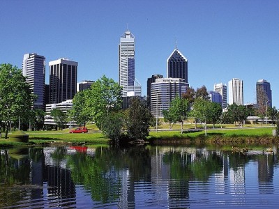 View over lake in park to city skyline, Perth, WA, Australia